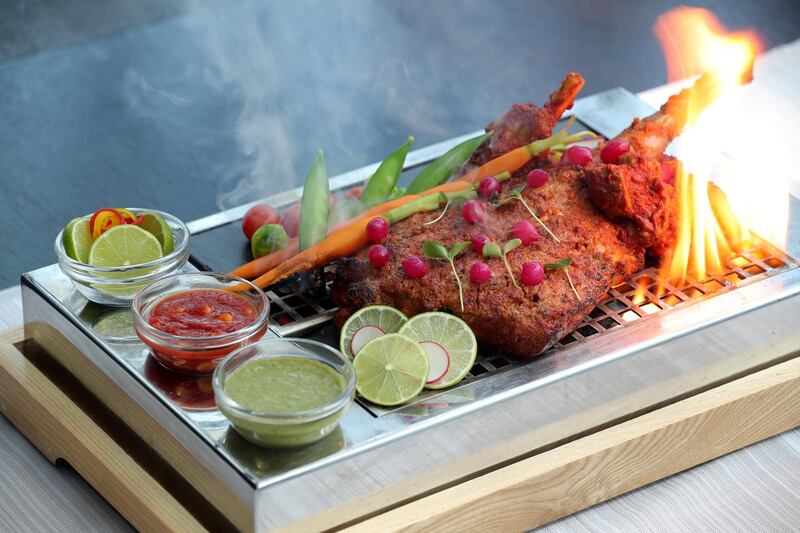 Dubai, United Arab Emirates - May 14, 2019: Iftar Signature Dish. Deconstructed Tandoori Raan from Signature by Sanjeev Kapoor at The Canvas Hotel Dubai MGallery. Tuesday the 14th of May 2019. Mankhool, Dubai. Chris Whiteoak / The National

Chefs description: Traditional Indian spiced marinated leg of baby lamb served on smoked charcoal grill with our signature gravy