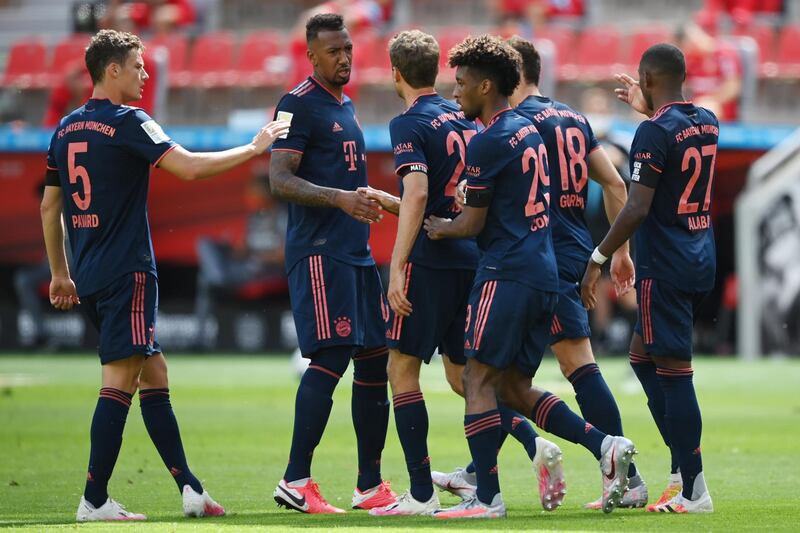Kingsley Coman celebrates his team's first goal with teammates. EPA