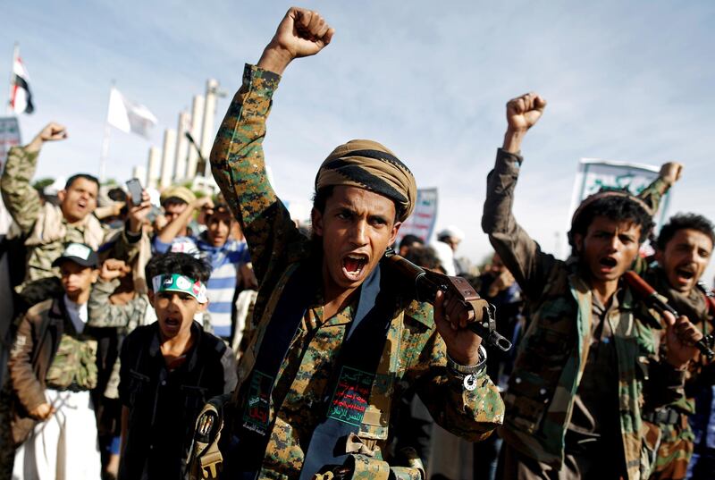 FILE PHOTO: Supporters of the Houthi movement shout slogans as they attend a rally to mark the 4th anniversary of the Saudi-led military intervention in Yemen's war, in Sanaa, Yemen March 26, 2019. REUTERS/Khaled Abdullah/File Photo