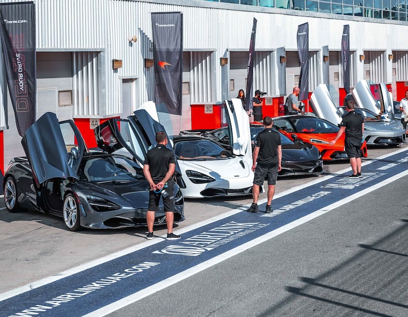 Dubai Autodrome's professional driving team check the vehicles.