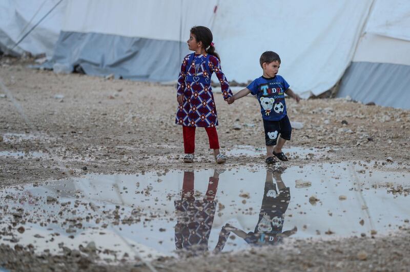 epa06756926 Children play between tents before sunset at a camp supported by the Turkish Red Crescent for people who were forcibly displaced from Eastern Ghouta, near al-Bel village, A'zaz city, north of Aleppo's countryside, Syria, 22 May 2018 (Issued 23 May 2018). ​Muslims around the world celebrate the holy month of Ramadan by praying during the night time and abstaining from eating, drinking, and sexual acts during the period between sunrise and sunset. Ramadan is the ninth month in the Islamic calendar and it is believed that the revelation of the first verse in Koran was during its last 10 nights.  EPA/MOHAMMED BADRA