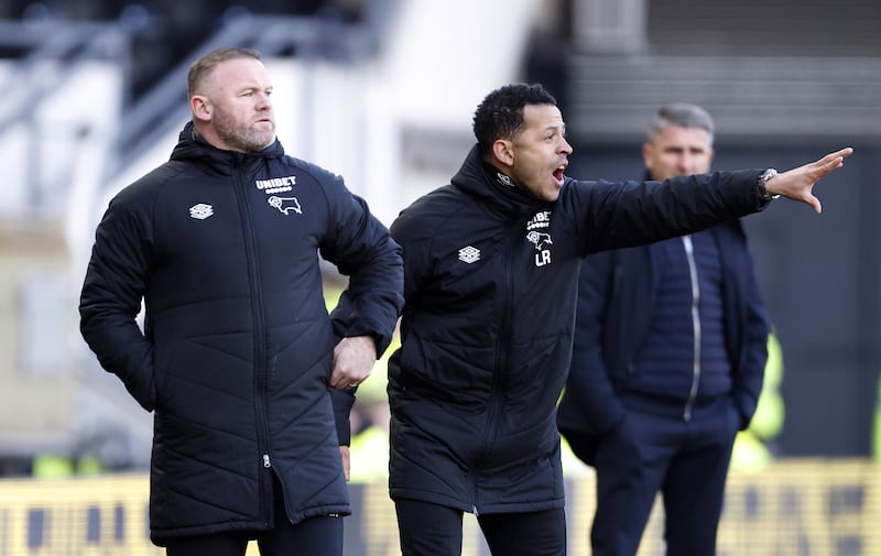 Derby County manager Wayne Rooney and assistant Liam Rosenior. PA