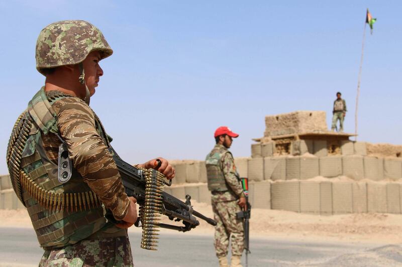 epa07203992 Afghan security officials stand guard at a check point in Helmand, Afghanistan, 02 December 2018. A top commander of the Taliban has been killed in Afghanistan's southern province of Helmand in a joint operation by Afghan and US Special Forces, Afghan officials and Taliban members said on 02 December. Abdul Manan, who was in charge of Helmand province for the insurgent group, was killed along with 29 others by an air strike on 01 December while he was meeting local commanders and fighters in the Nawzad district, Helmand provincial governor Mohammad Yasin Khan said.  EPA/WATAN YAR