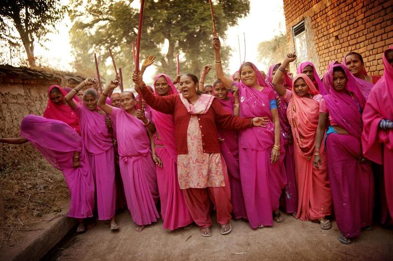 Members of the Gulabi, or pink gang make their presence known in a village in Uttar Pradesh, India. The Gulabi Gang is reported to have more than 20,000 members. Jonas Gratzer / LightRocket via Getty Images