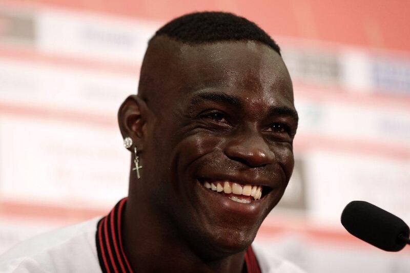 Nice’s new signing Mario Balotelli smiles as he gives a press conference. Valery Hache / AFP