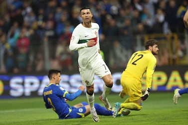 Portugal's Cristiano Ronaldo, centre, in action during the Euro 2024 group J qualifying soccer match between Bosnia-Herzegovina and Portugal, at the Bilino Polje Stadium in Zenica, Bosnia and Herzegovina, Monday, Oct.  16, 2023.  (AP Photo / Armin Durgut)
