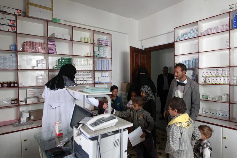 A Yemeni family receives Thalassaemia medication at a pharmacy in Sanaa on March 2, 2016. Mohammed Huwais / AFP Photo
