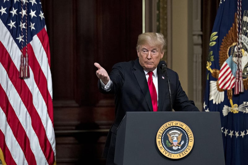 U.S. President Donald Trump gestures while speaking during an Interagency Task Force to Monitor and Combat Trafficking in Persons annual meeting in the Indian Treaty Room of the Eisenhower Executive Office Building in Washington, D.C., U.S., on Thursday, Oct. 11, 2018. Trump on Wednesday said the "Fed has gone crazy" with interest-rate increases this year and doubled-down on Thursday, blaming the nation's "out of control" central bank for a sixth straight day of losses in U.S. equities. Still, he said, "I'm not going to fire him." Photographer: Andrew Harrer/Bloomberg