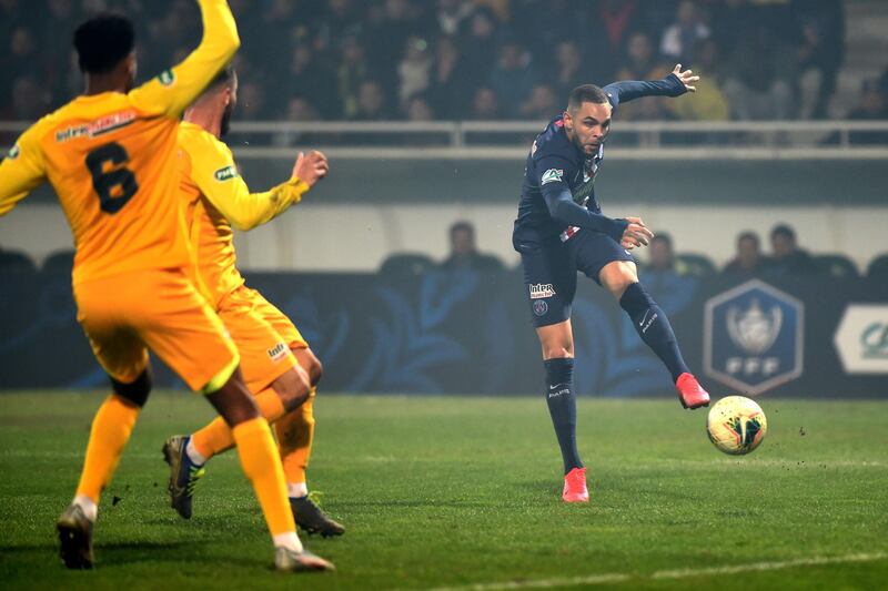 Paris Saint-Germain's French defender Layvin Kurzawa (R) kicks the ball. AFP