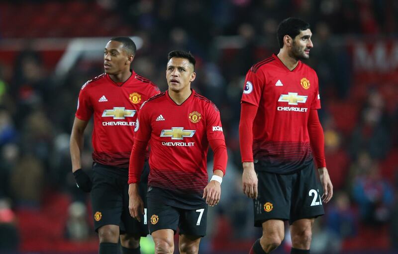 MANCHESTER, ENGLAND - NOVEMBER 24:  Alexis Sanchez, Anthony Martial and Marouane Fellaini of Manchester United look dejected after the Premier League match between Manchester United and Crystal Palace at Old Trafford on November 24, 2018 in Manchester, United Kingdom.  (Photo by Alex Livesey/Getty Images)