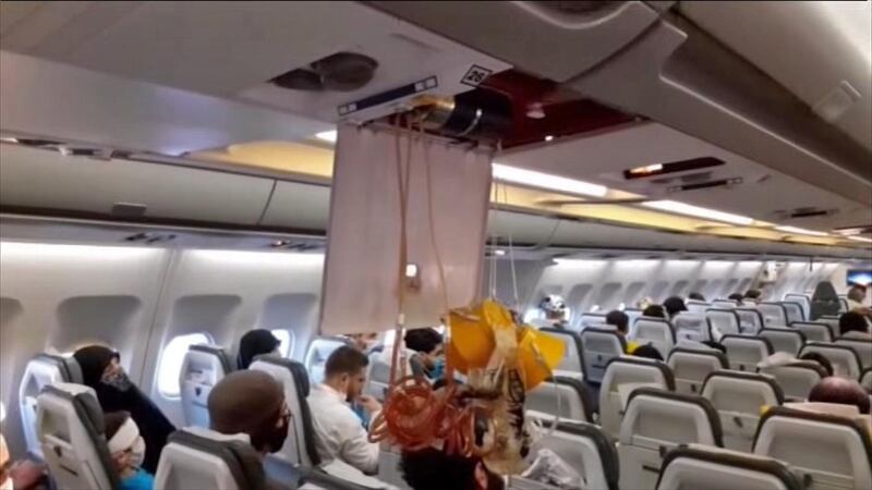 An image grab from a video released by state-run Iran Press news agency reportedly shows released oxygen masks in the cabin of the Mahan Air flight from Tehran to Beirut that was intercepted by a US F-15 jet. AFP