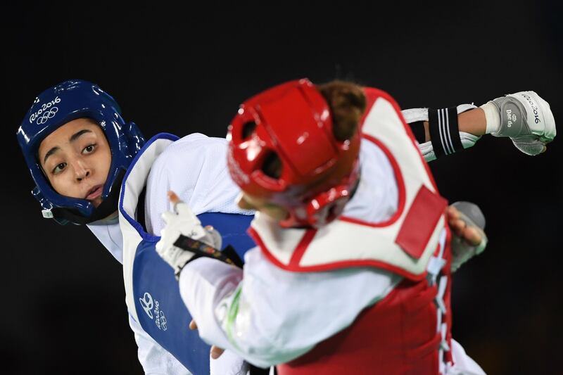 Iran's Kimia Alizadeh Zenoorin (L)  competes against Sweden's Nikita Glasnovic  during their women’s taekwondo bronze medal bout in the -57kg category as part of the Rio 2016 Olympic Games, on August 18, 2016, at the Carioca Arena 3, in Rio de Janeiro. / AFP PHOTO / Kirill KUDRYAVTSEV