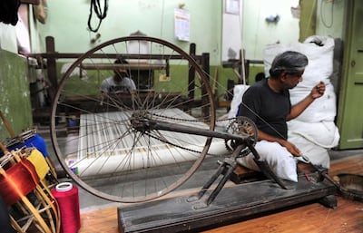 India’s famous Banarasi saris are woven by hand on a loom in Varanasi AFP