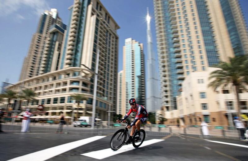 US cyclist Taylor Phinney competes in the first stage of the Dubai Tour 2014 cycling competition in front of the world’s tallest building, the Burj Khalifa, in Dubai on Wednesday. Phinney won the opening stage.  Ali Haider / EPA
