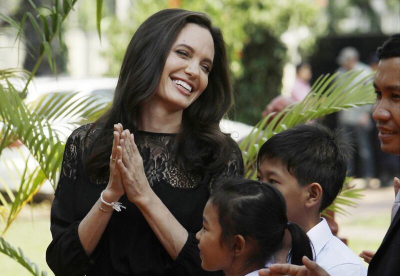 Hollywood actress Angelina Jolie smiles before a press conference in Siem Reap province, Cambodia, Saturday, Feb. 18, 2017. Jolie on Saturday launches her two-day film screening of "First They Killed My Father" in Angkor complex in Siem Reap province. (AP Photo/Heng Sinith)