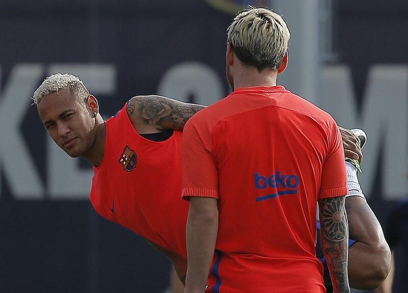 Barcelona forwards Neymar, left, and Lionel Messi during the training session. Manu Fernandez / AP Photo
