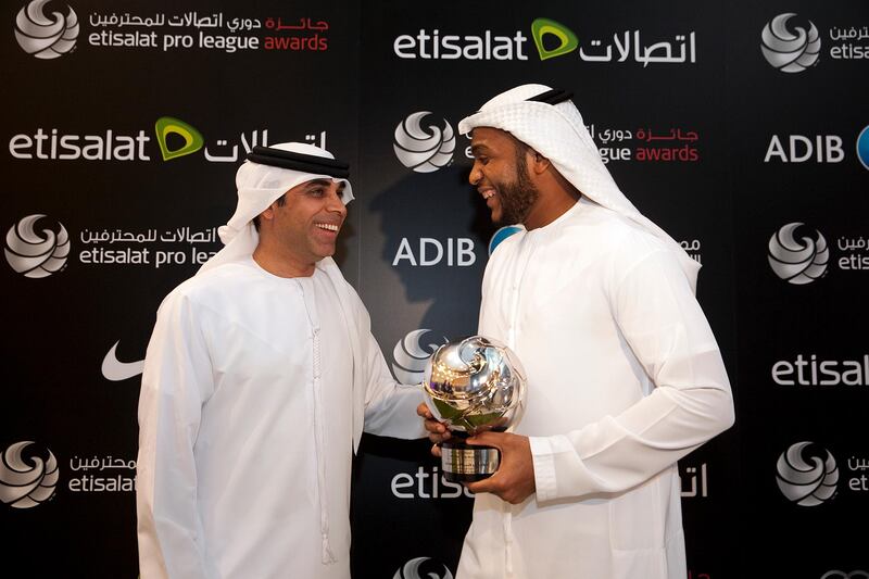 Abu Dhabi, United Arab Emirates, May 26, 2013: 
(L) UAE national football team coach Mahdi Ali celebrates with the goalie of the year (R) Ali Kasheif of Abu Dhabi's Al Jazira team after the Etisalat Pro League Awards ceremony on Sunday, May 26, 2013, at the Abu Dhabi National Exhibition Center in Abu Dhabi.
Silvia Razgova / The National

