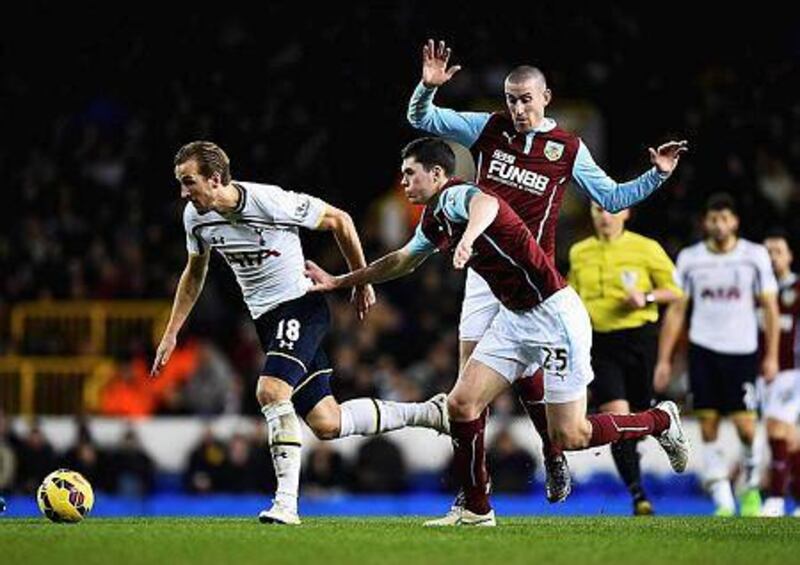 Harry Kane, left, of Tottenham Hotspur is closed down by Michael Keane of Burnley during their Premier League match at White Hart Lane on December 20, 2014 in London, England. (Photo by Laurence Griffiths/Getty Images)