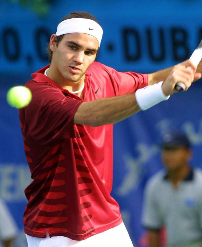 Roger Federer in action at the Dubai Tennis Open tournament in 2002.  Rabih Moghrabi / AFP