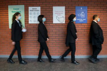 Pupils queue for a socially distanced school assembly in Manchester, England. AP