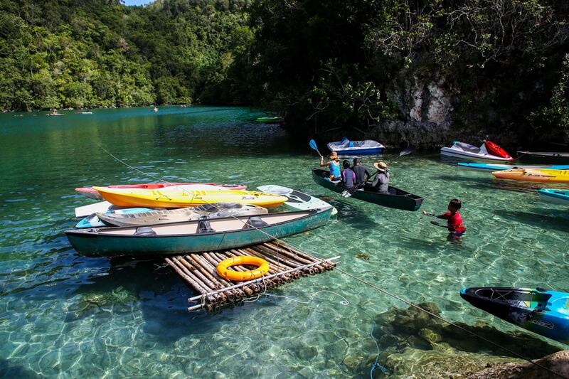 Tourists paddle kayaks inside a lagoon on SIargao Island in the province of Surigao del Norte of the Philippines. Getty Images