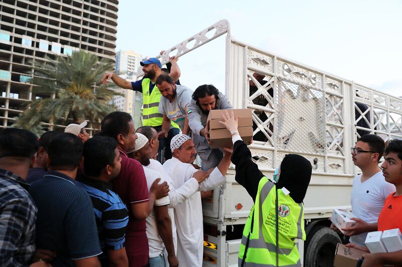 Iftar meals being distributed at the Al Majaz in Sharjah waterfront on the first day of Ramadan. Pawan Singh / The National