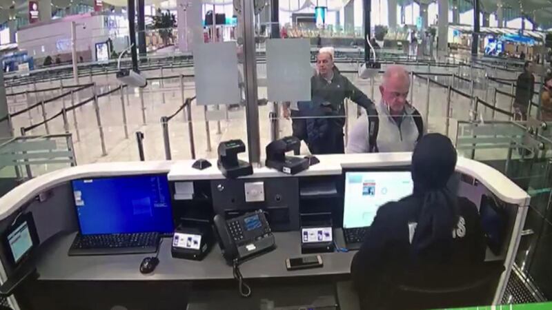 This handout video grab image released by The Istanbul Police Department on January 17, 2020, shows Michael Taylor (2R) and George Antoine Zayek (C) at passport control in Istanbul Airport,  two men accused of helping fugitive businessman Carlos Ghosn escape via an Istanbul airport, as he fled a corruption trial in Japan. - Turkey's state news agency has published images of two men accused of helping fugitive businessman Carlos Ghosn escape via an Istanbul airport, as he fled a corruption trial in Japan.  The security camera images, first made public on January 16, 2020, show Michael Taylor and George Antoine Zayek at passport control in Istanbul Airport, according to state news agency Anadolu. (Photo by HO / TURKISH POLICE / AFP) / RESTRICTED TO EDITORIAL USE - MANDATORY CREDIT "AFP PHOTO / TURKISH POLICE" - NO MARKETING - NO ADVERTISING CAMPAIGNS - DISTRIBUTED AS A SERVICE TO CLIENTS