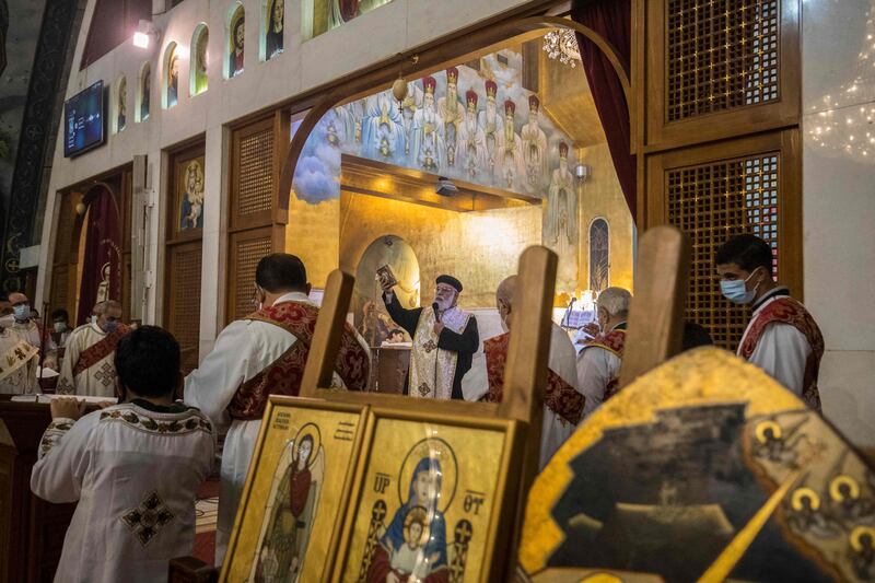 Coptic priest Athnaceyous leads Christmas Mass at the Archangel Michael Coptic Orthodox Church. AFP