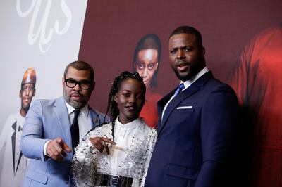 Director Jordan Peele, (L) and actors Lupita Nyong'o (C) and Winston Duke attend the "Us" premiere at The Museum of Modern Art in New York City, New York, U.S., March 19, 2019. REUTERS/Eduardo Munoz
