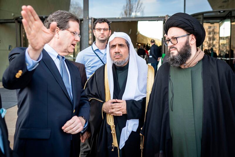 The CEO of the American Jewish Committee, David Harris, left; the Secretary General of the Muslim World League Mohammad Abdulkarim Al Issa; and a member of the Muslim delegation visit the POLIN Museum of the History of Polish Jews on in Warsaw. AFP