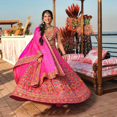 Radhika Merchant wears an outfit by Indian designer duo Abu Jani and Sandeep Khosla at her mehendi ceremony, ahead of her engagement to Anant Ambani. Photo: @abujanisandeepkhosla / Instagram