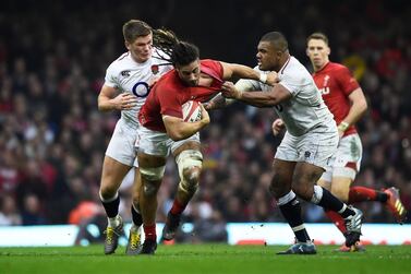 Wales' Josh Navidi is tackled by England prop Kyle Sinckler, right, during the Six Nations match at Cardiff's Principality Stadium. Reuters