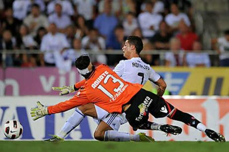 Cristiano Ronaldo, right, takes on goalkeeper Dudu Aouate of Mallorca shortly before injuring himself.