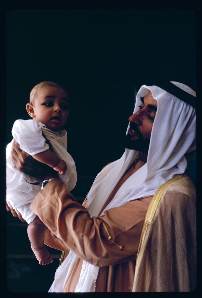 Sheikh Zayed, Ruler of Abu Dhabi, with the sixth child from his second wife, Fatima, in April 1970. Photo: Eve Arnold Papers. Yale Collection of American Literature, Beinecke Rare Book and Manuscript Library