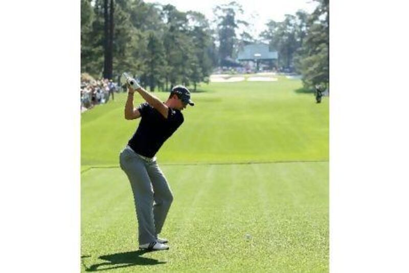 Justin Rose hits a shot during a practice round at Augusta National yesterday.