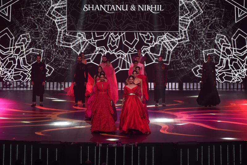 Models present looks by designer Nikhil and Shantanu on stage during the IIFA Rocks. Photo: AFP