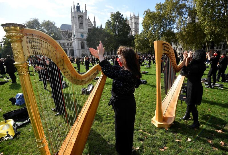 Harpists perform during the protest. Reuters