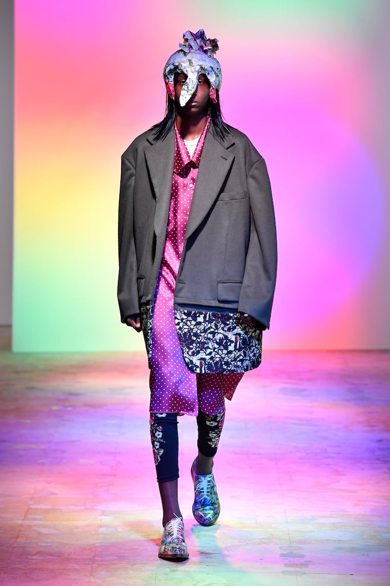 At Comme des Garcons, for spring / summer 2022, a suit jacket has the bottom section replaced with a floral pattern fabric. Courtesy Comme des Garcons