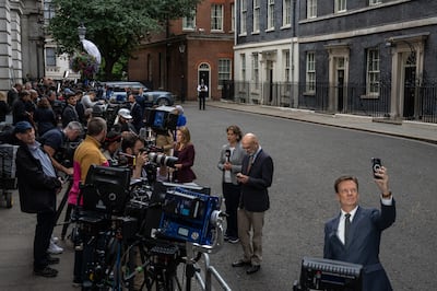 Members of the media wait outside 10 Downing Street on Thursday morning. Getty Images