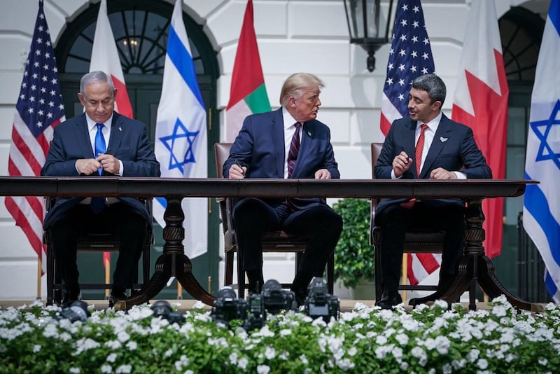 Israeli Prime Minister Benjamin Netanyahu, US President Donald Trump, and UAE Foreign Minister Abdullah bin Zayed. Courtesy MOFAIC