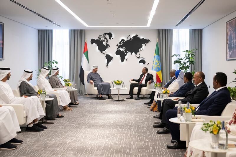 President Sheikh Mohamed speaks with Mr Abiy at the Office of the Prime Minister. Seen with, from left, Sheikh Shakhbout bin Nahyan, Minister of State, Sheikh Mohammed bin Hamad, private affairs adviser at the Presidential Court, Sheikh Hamdan bin Mohamed, and Sheikh Mansour bin Zayed, Vice President, Deputy Prime Minister and Minister of the Presidential Court