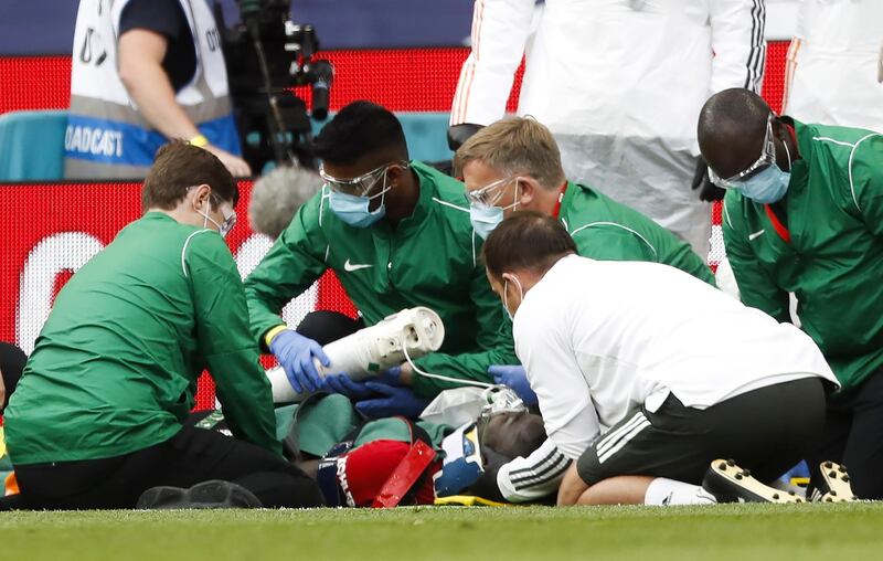 Eric Bailly of Manchester United receives treatment after a clash of heads. EPA