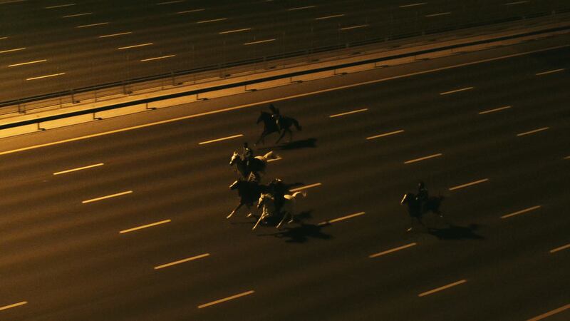 An empty highway, save for five horses and their riders. Photo: OSN