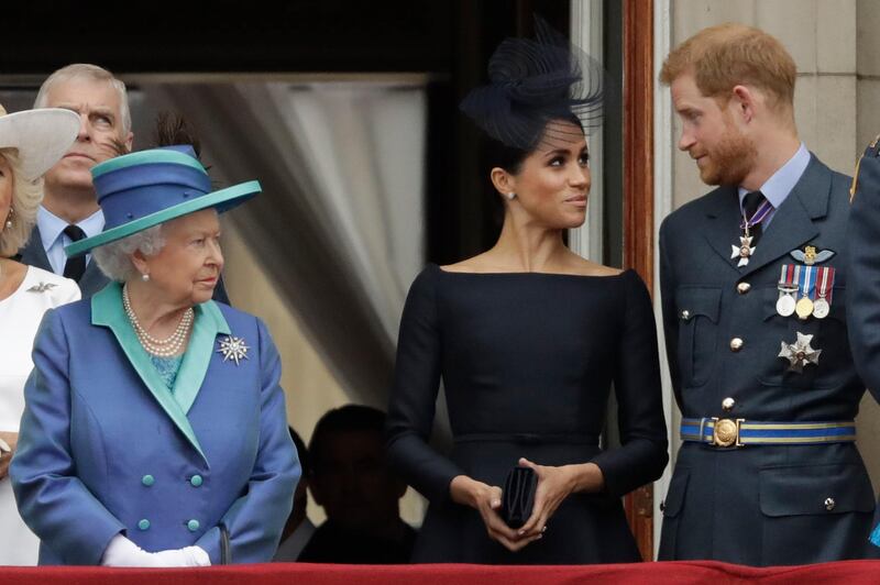 FILE - In this Tuesday, July 10, 2018 file photo Britain's Queen Elizabeth II, Meghan the Duchess of Sussex and Prince Harry stand on a balcony to watch a flypast of Royal Air Force aircraft pass over Buckingham Palace in London. The second baby for the Duke and Duchess of Sussex is officially here: Meghan gave birth to a healthy girl on Friday, June 4, 2021. A spokesperson for Prince Harry and Meghan said the couple welcomed their child Lilibet â€œLiliâ€ Diana Mountbatten-Windsor. Their daughter weighed in at 7 lbs, 11 oz.  Her first name, Lilibet, is a nod to Her Majesty The Queen's nickname. Her middle name is in honor of her grandmother and Harry's mother. The baby is the eighth in line to the British throne. Â  (AP Photo/Matt Dunham, File)