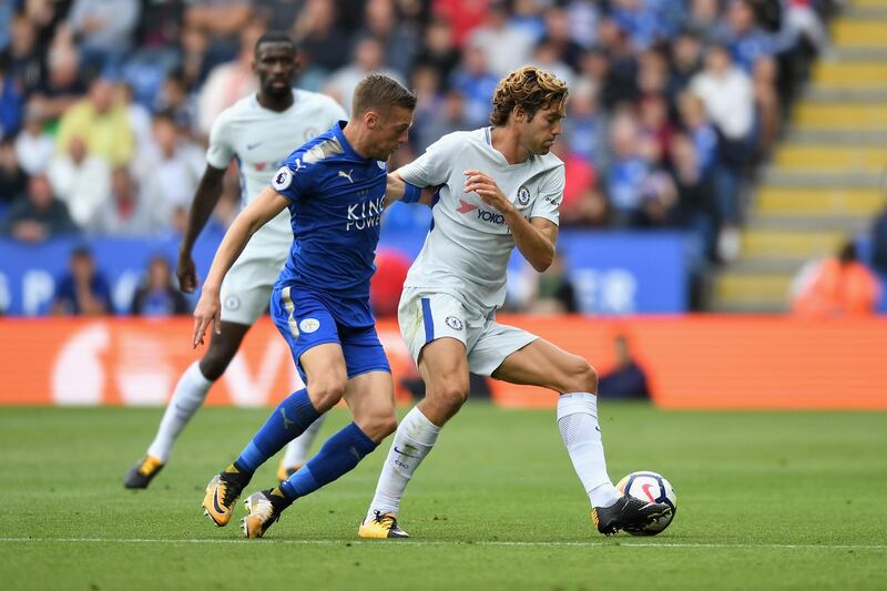 Chelsea wing-back Marcos Alonso shields the ball from Leicester striker Jamie Vardy. Michael Regan / Getty Images)