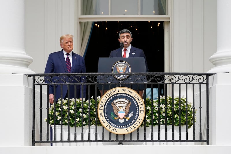 Sheikh Abdullah speaks as Mr Trump looks on before the signing of Abraham Accord  on the South Lawn of the White House. AP