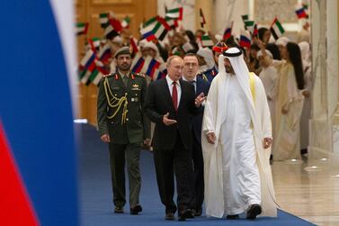 Russian President Vladimir Putin, foreground left, and Abu Dhabi Crown Prince Mohamed bin Zayed al-Nahyan, right, attend the official welcome ceremony in Abu Dhabi, United Arab Emirates, Tuesday, Oct. 15, 2019. (AP Photo/Alexander Zemlianichenko, Pool)