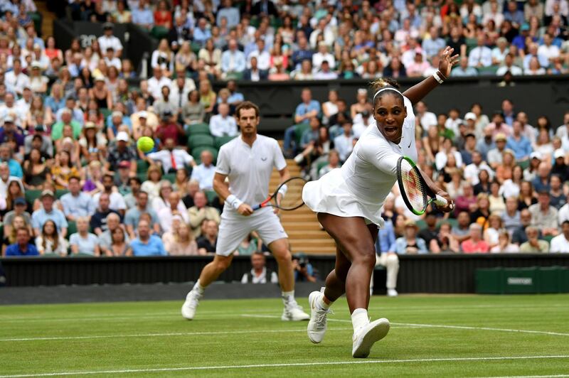 LONDON, ENGLAND - JULY 09: Serena Williams of the United States, playing partner of Andy Murray of Great Britain plays a backhand in their Mixed Doubles second round match against Fabrice Martin of France and Raquel Atawo of the United States during Day Eight of The Championships - Wimbledon 2019 at All England Lawn Tennis and Croquet Club on July 09, 2019 in London, England. (Photo by Mike Hewitt/Getty Images) *** BESTPIX ***