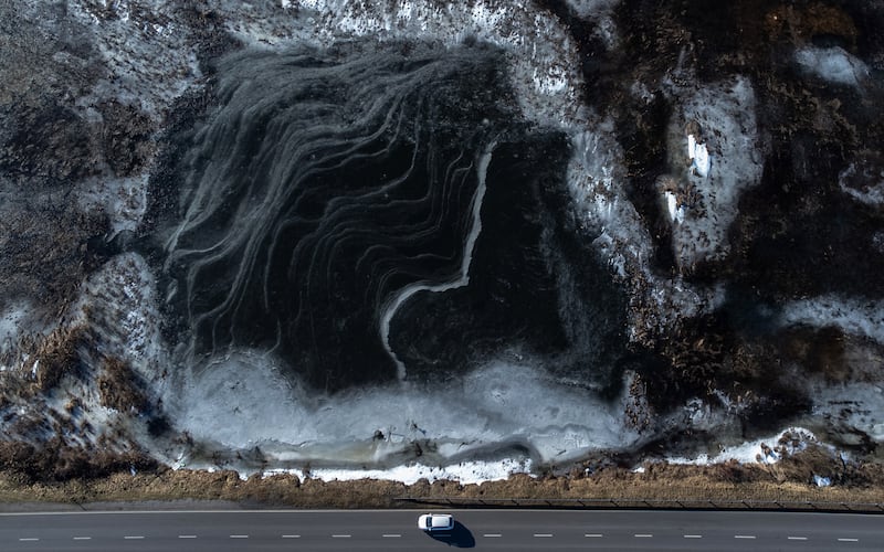 A drone shot shows ice floes drifting on the Wieprz river in Jeziorzany village, eastern Poland. EPA 