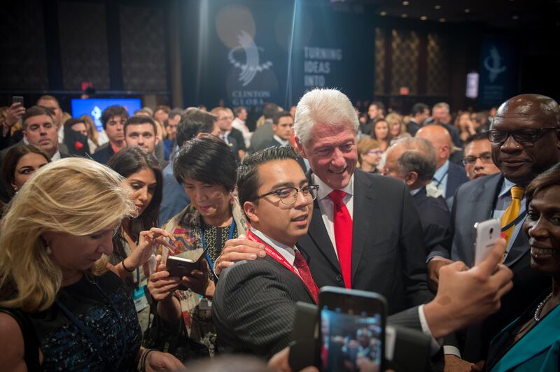 Former President and Founding Chairman of the Clinton Global Initiative Bill Clinton, right, greets people following his speech at the closing Plenary Session: Imagine All The People at the Clinton Global Initiative, on September, 21, 2016 in New York. / AFP PHOTO / Bryan R. Smith